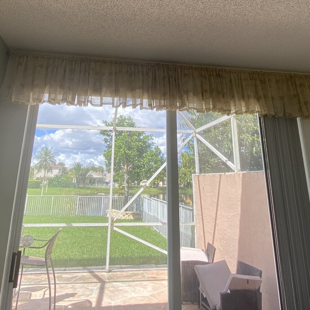Elegant Curtain Valance with Gold Colored Rod